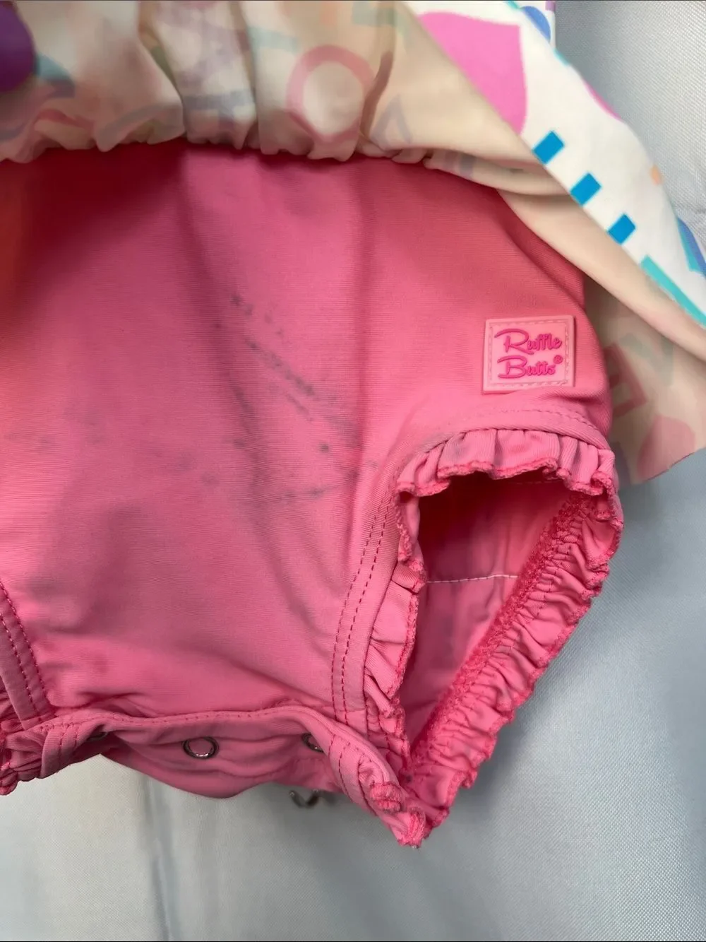 Ruffle Butts pink Love print ruffle bottom one piece rash guard swim-flaw